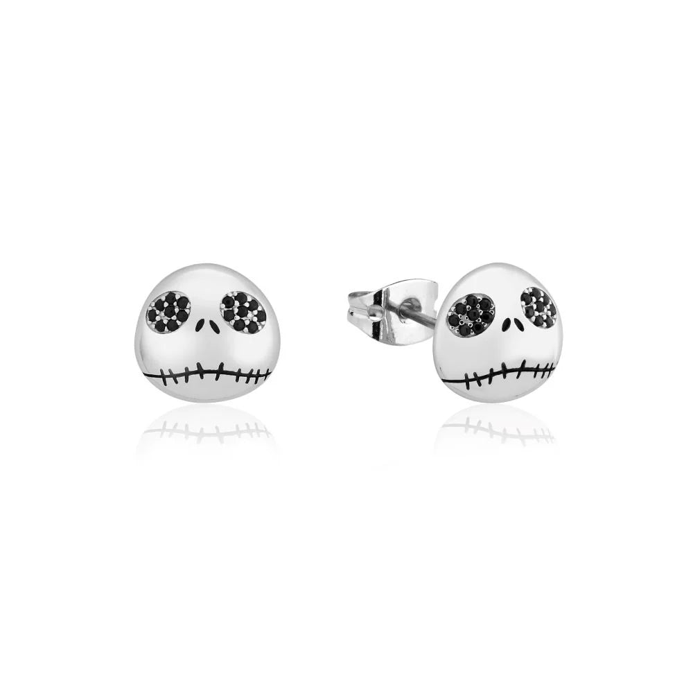 Skull-shaped earrings with black gemstones on a white background